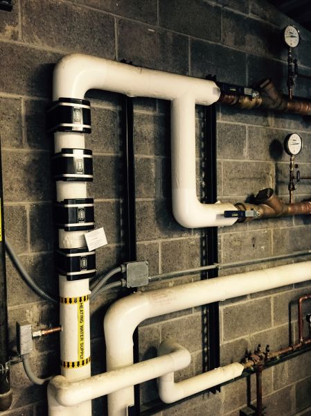 GMX Model 8000s installed on the feed line to a radiant heating system in a commercial building in The U.S. The GMX units greatly control the scale in hard water.
